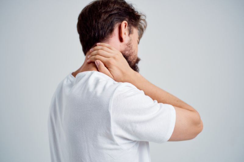 Man holding his neck in pain