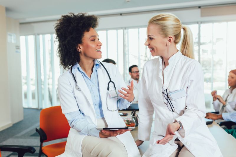 Team of doctors smiling and working together